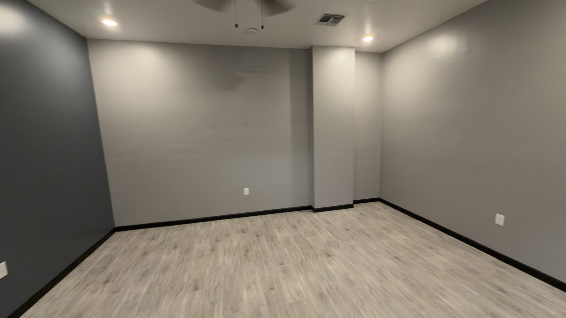 A wide view of the finished office before the desk and meeting table are moved in.